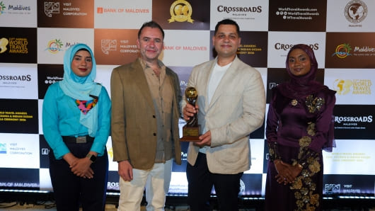 TRIBE Phuket Patong Cluster General Manager and Cluster Marketing Head holding the award